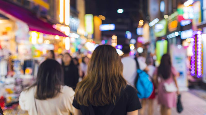 Blurred many people visit and shopping at hongdae shopping street in Seoul, South Korea